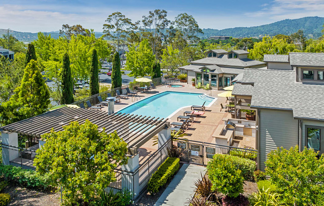 a view of the pool at the resort on a sunny day