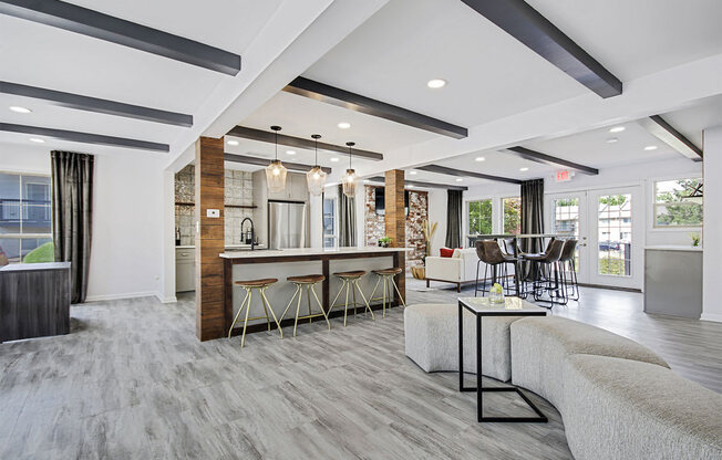 a living room with a bar and a kitchen