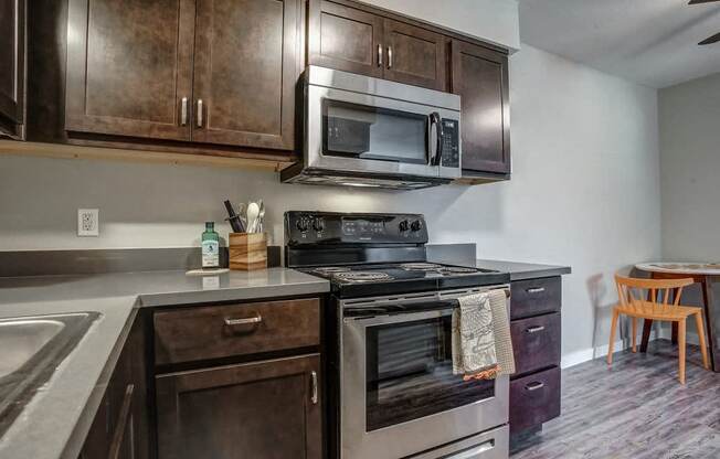 Image of kitchen with stainless steel oven and microwave