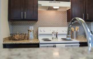 This is a photo of the kitchen of the 991 square foot 2 bedroom, 2 bathroom apartment at The Biltmore Apartments in Dallas, TX.