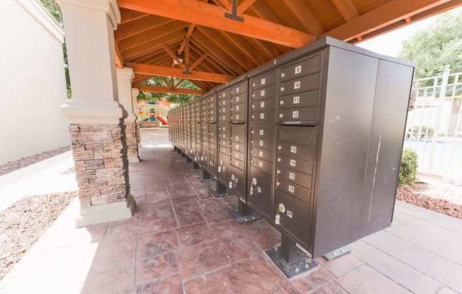 a line of mailboxes on the side of a building