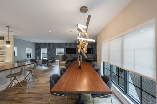 a conference room with a long wooden table and chairs