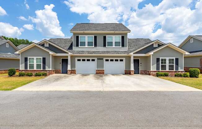 a large house with a driveway in front of it