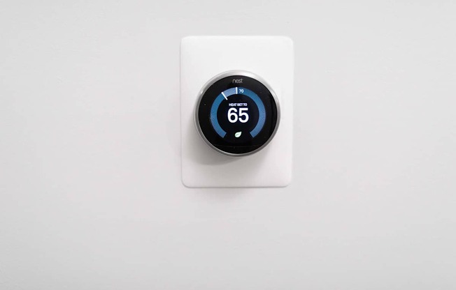 an electric thermostat with a white background
