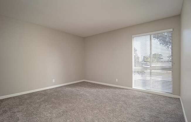 Living Room With Glass Door at Parc at 5 Apartments, Downey