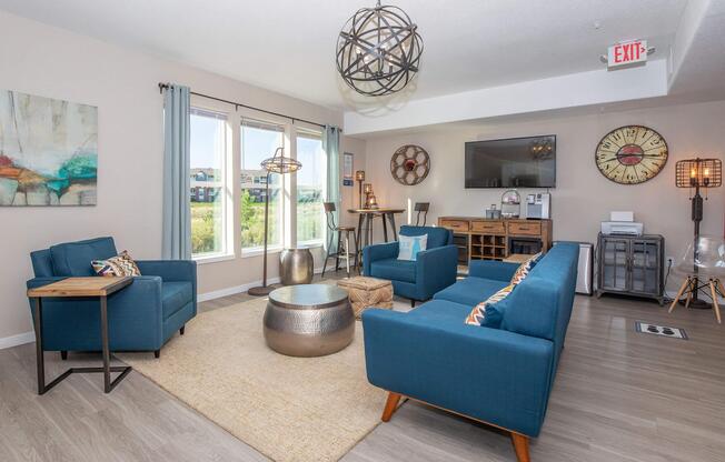 a living room filled with furniture and a large window