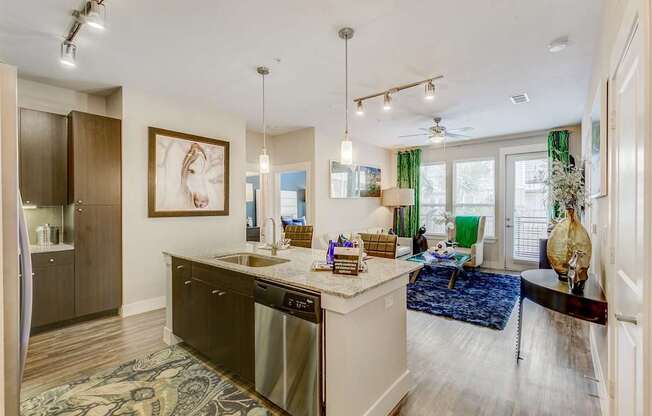 A kitchen with a large island and a dining area.