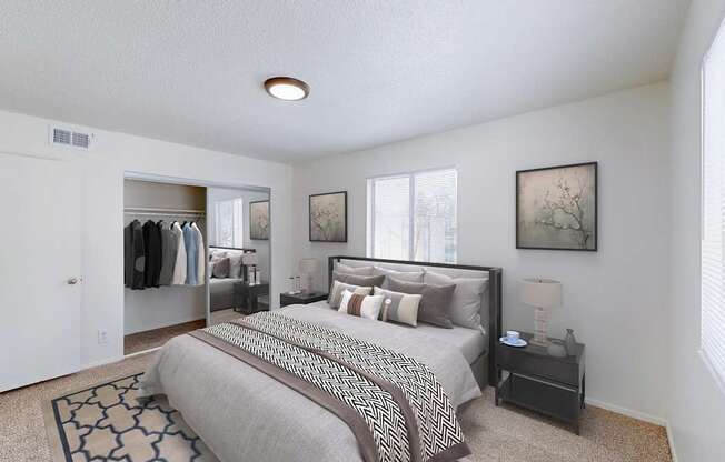 A bedroom with a large bed and a clothing closet.