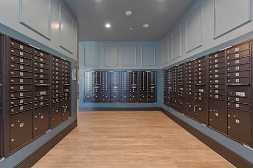 a lockers room with blue walls and a wood floor at SevenO2 Main Apartments, Utah