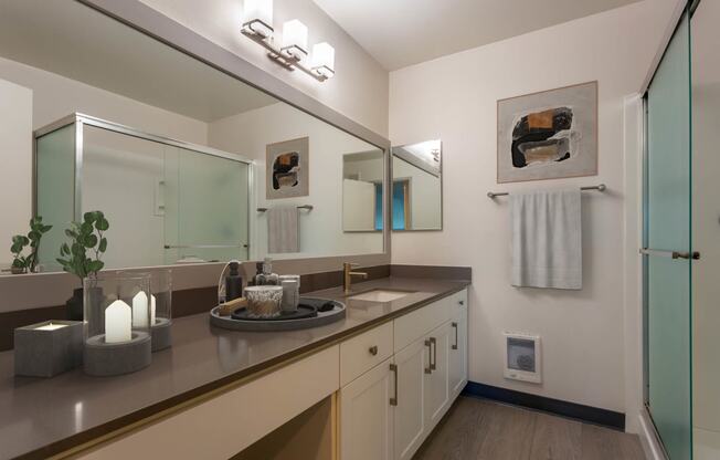 a bathroom with a sink and a mirror at Delphine on Diamond, California