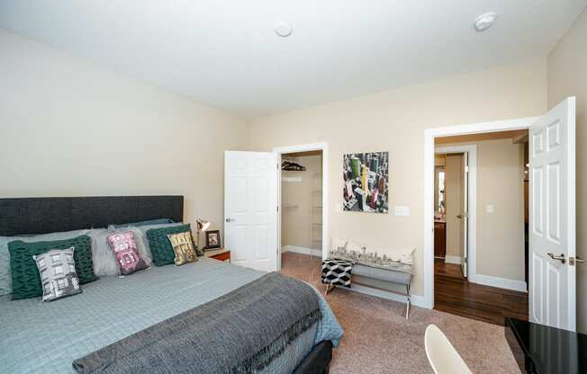 a bedroom with a bed and a closet
