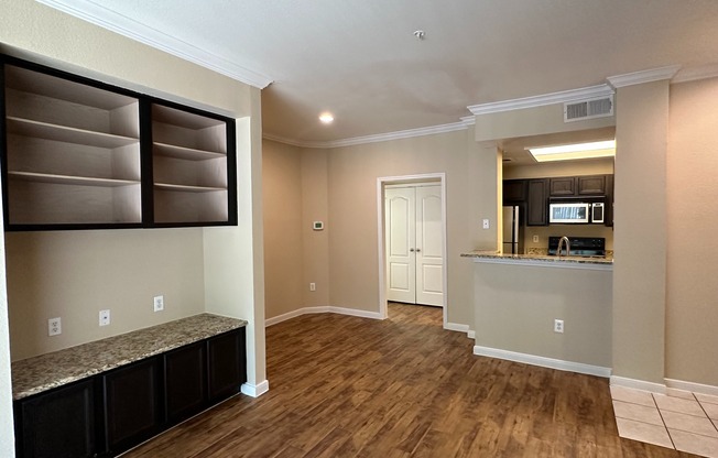 A1 | Living Area | Built in shelving | Open Kitchen | Wood style flooring
