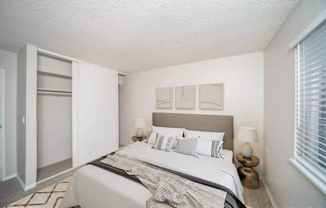 Bedroom with a large bed and a window at Avery Park in Englewood, CO