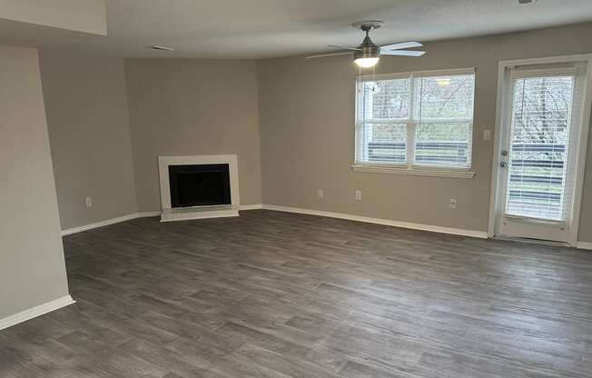 A newly renovated living area with fireplace in North Oaks Landing