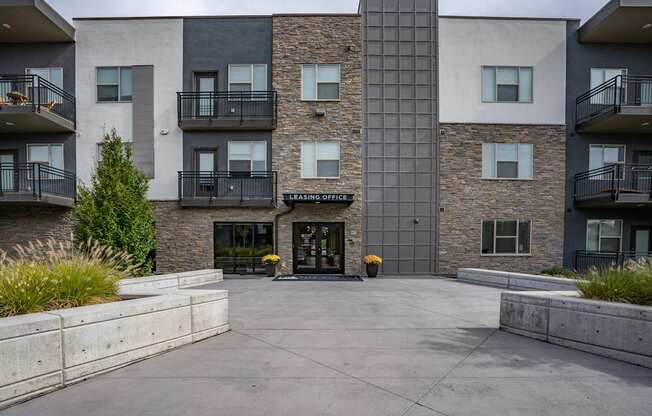 an empty courtyard in front of an apartment building
