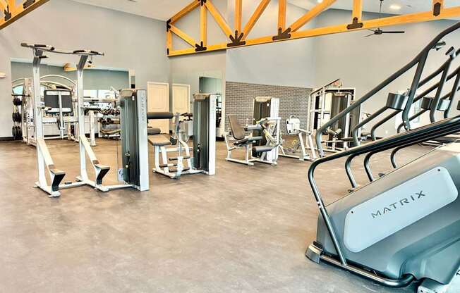 A gym with a variety of equipment including a Matrix machine.
