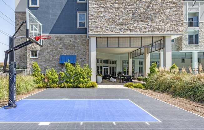 a basketball court in front of a building