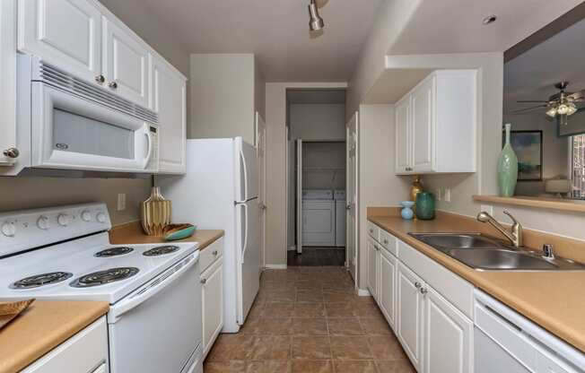 Wooden and white combo appliances at The Covington by Picerne, Las Vegas, NV