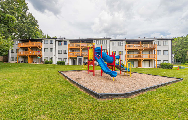 Playground with a slide at Pinewood Townhomes, Tucker, GA, 30084