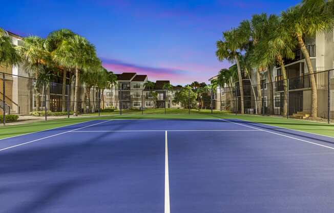 a tennis court at the enclave at woodbridge apartments in sugar land, tx