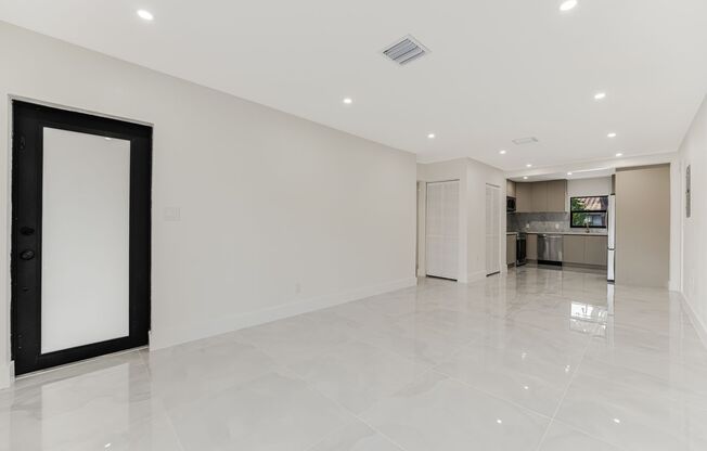 Beautifully renovated 4 bed 2 bath home with a large backyard and parking.