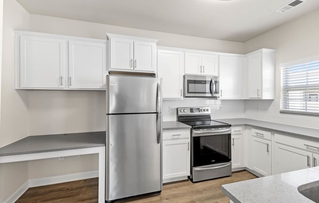 Stainless Steel Appliances and updated fixtures in kitchen