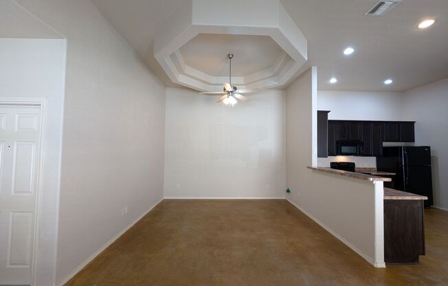 Stained Concrete Floors / No Carpet / Fridge / Covered Back Patio / CISD