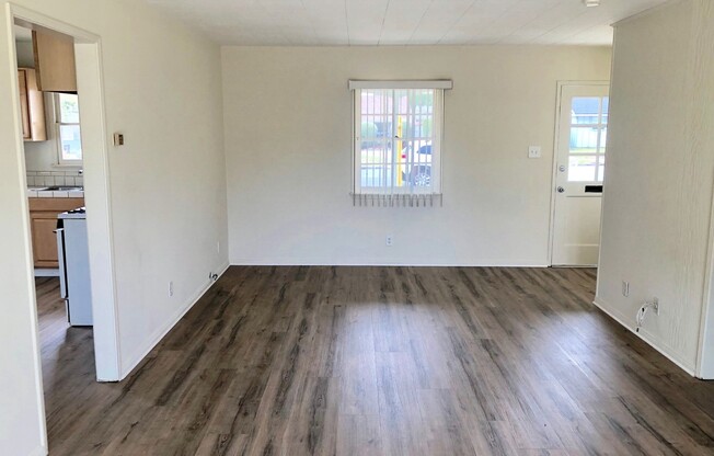 Quaint Midtown Home with New Wood Flooring & Large Yard!!