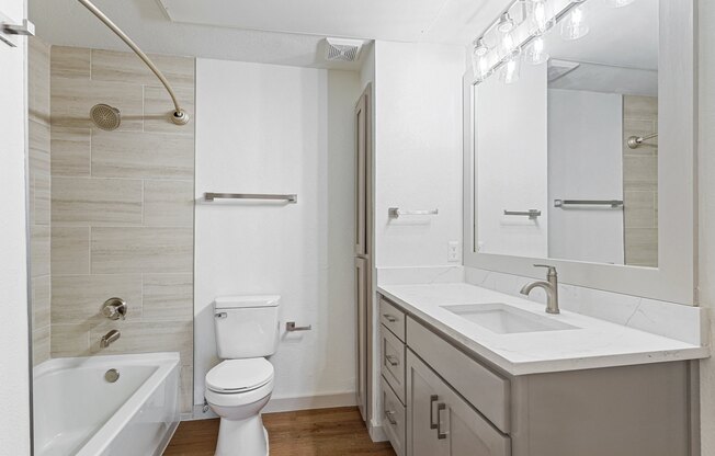 a bathroom with a sink toilet and a shower at The Legends at Eagle Mountain Lake, Fort Worth, TX