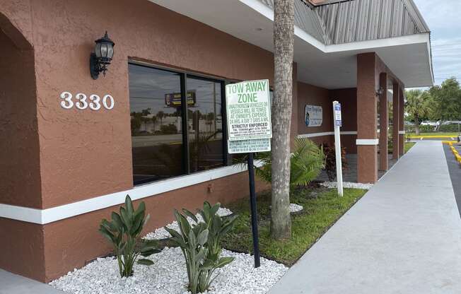 a sign in front of a building at Colonial Apartments, Orlando, FL 32808