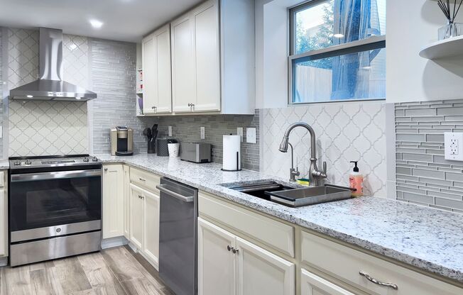 Discover the charm of this FULLY FURNISHED basement unit, tucked away in a beautifully updated bungalow in the heart of the historic Cherry neighborhood