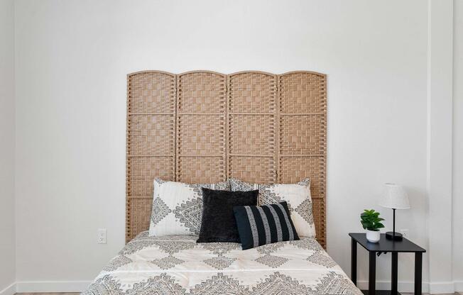 a bedroom with a bed and a chair in a room