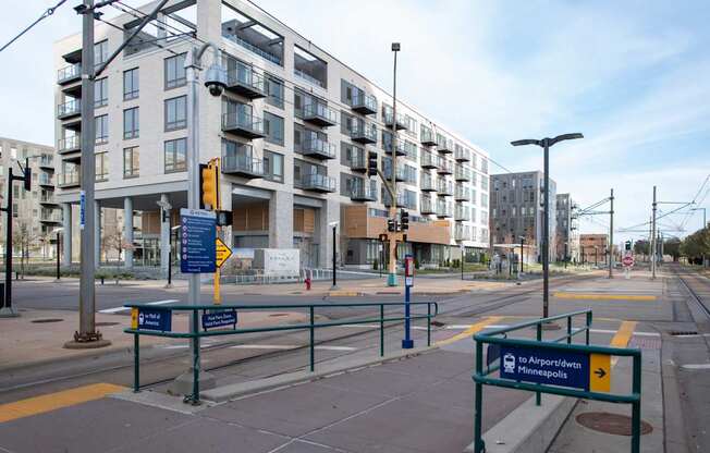 A street view of a city with a sign that reads