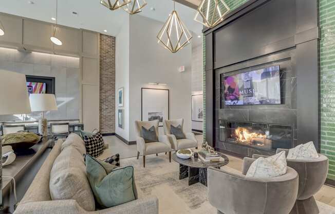 a living room with a fireplace and couches