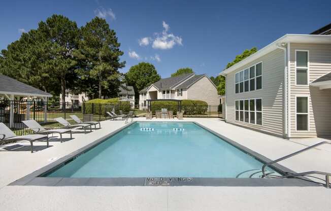 the swimming pool at villas on the avenue apartments