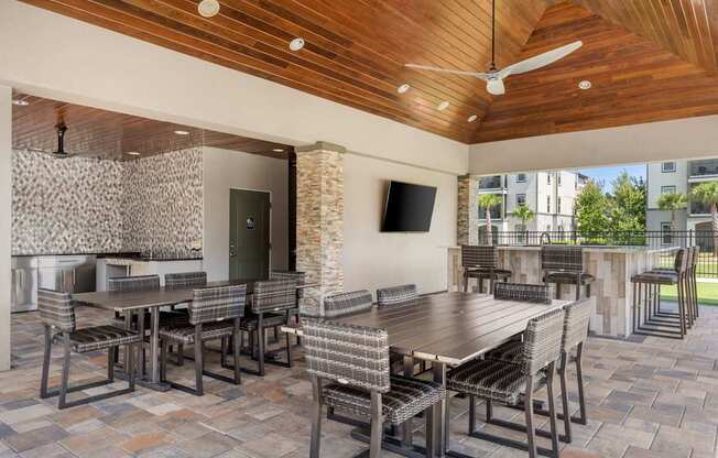 A patio with a table and chairs.