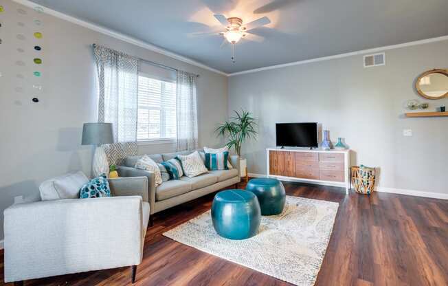 a living room with a couch and a tv