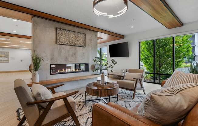 a living room with couches and chairs and a fireplace
