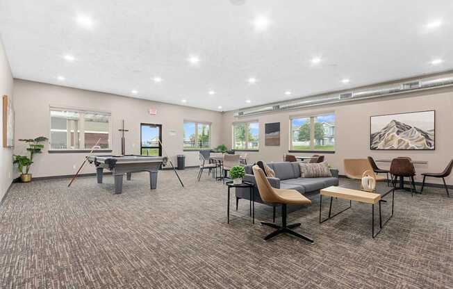 A room with a pool table and a couch.
