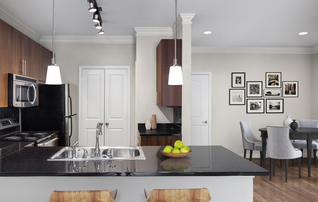 Kitchen featuring a peninsula island and sink