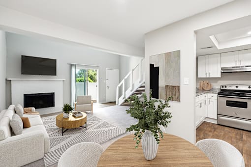 A modern living room with a fireplace and a television.