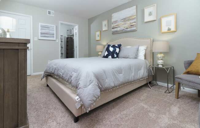 The master bedroom features neutral walls and a spacious layout at Woods of Fairfax