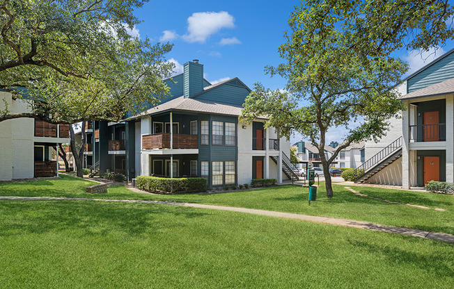 Exterior Community Building and Landscape at Bridges at Deer Run Apartments in Dallas, TX.