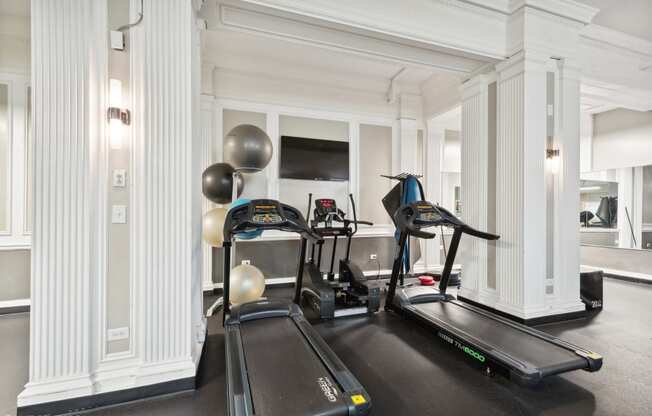 two treadmills in the gym of a hotel room at CWE Apartments, St. Louis, 63108