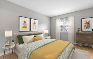 a bedroom with a bed and pictures on the wall