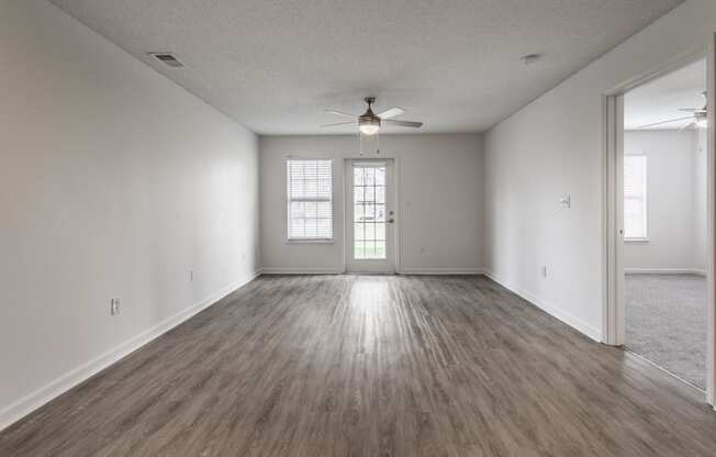 living room with a ceiling fan at Latitudes Apartments in Indianapolis, IN 46237