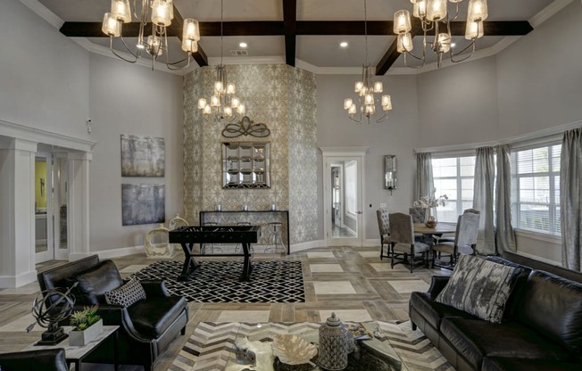 a living room with a fireplace and a piano