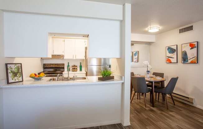 Kitchen and Dining Area at Whispering Sands Apartments in Albuquerque