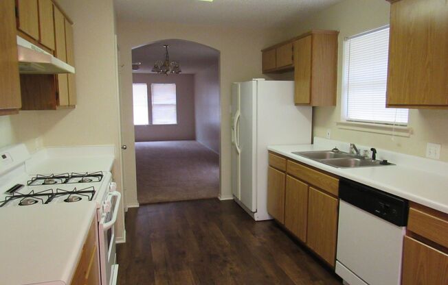 Cozy 3/2/2 one story with fence yard just west of I-35!