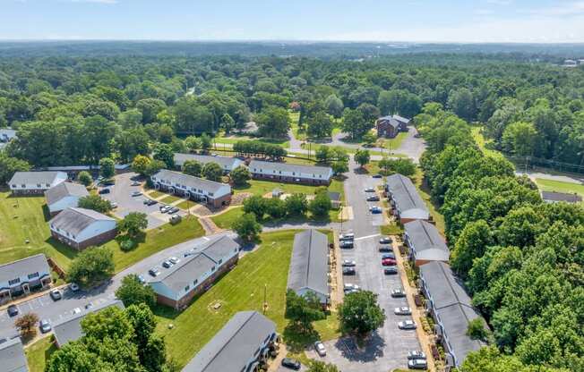 an aerial view of a neighborhood of buildings and a parking lot